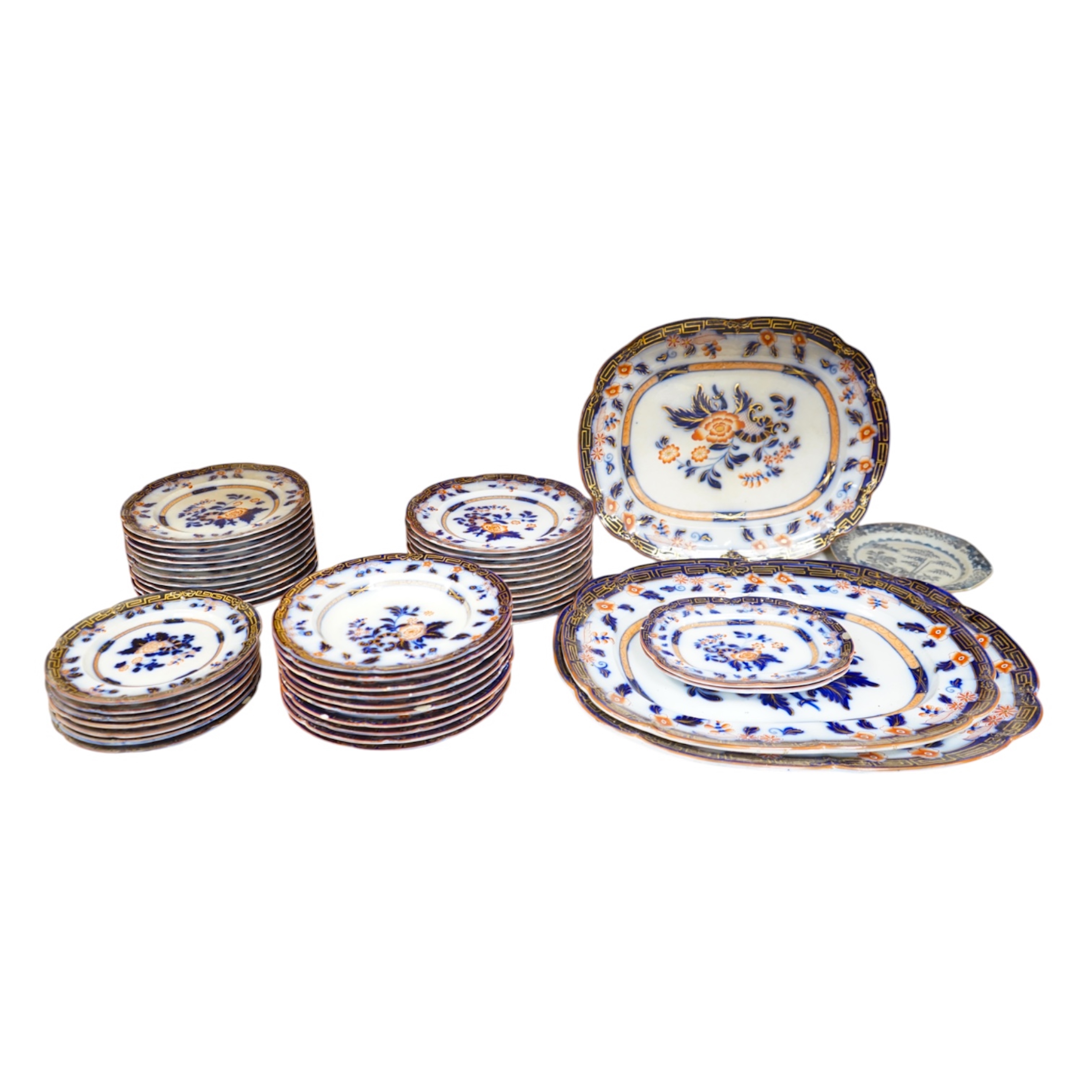 A Staffordshire flow blue ironstone part dinner service, comprising twenty-two 26.5cm diameter plates, seven 23.5cm diameter plates, ten 26.5cm diameter dishes, two small serving dishes and three large serving dishes, la